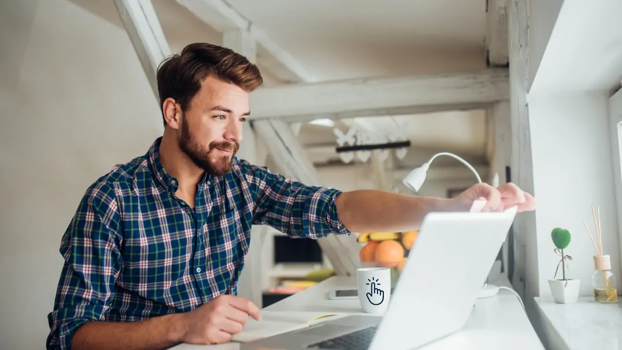 A guy working on a laptop