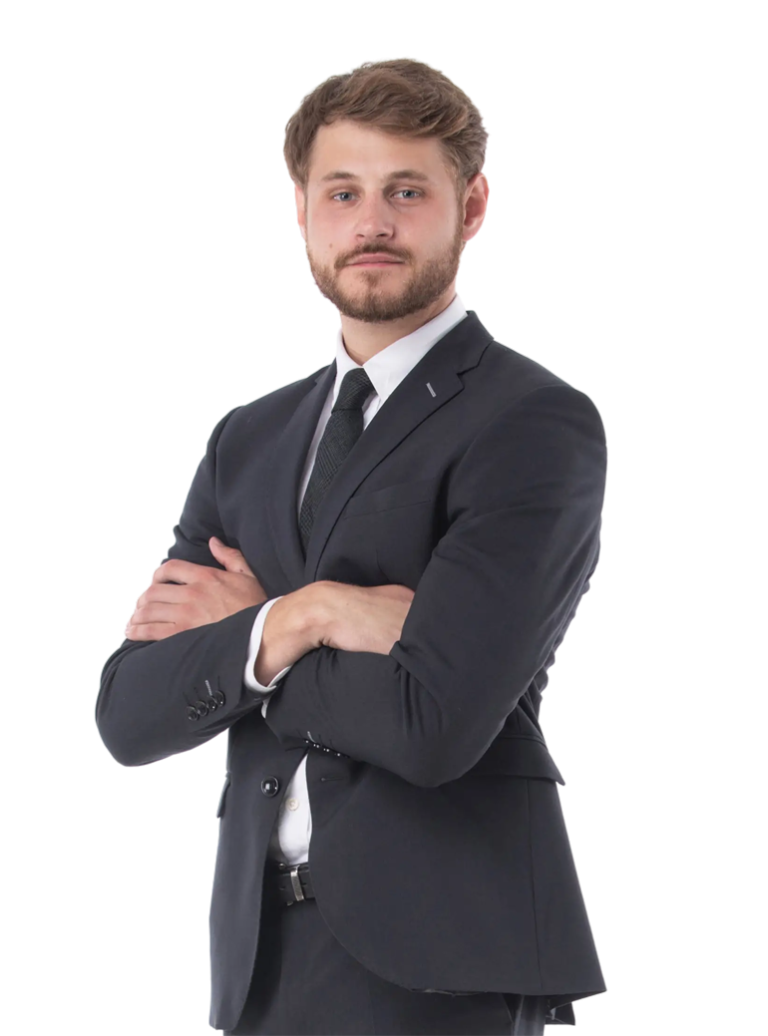 A person in formal clothes with folded hands.